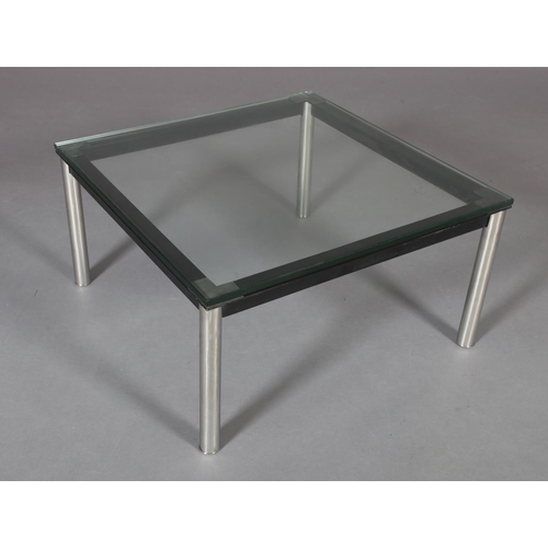 179 - A clear glass coffee table, square, on black and chrome tubular legs, 70cm