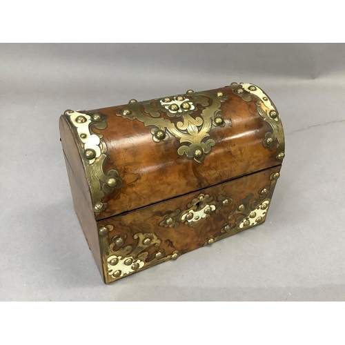 15 - A Victorian figured walnut dome-topped stationery box with cut gilded brass and ivory work, interior... 