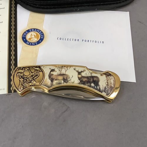 17 - A ten point buck collector knife by Franklin Mint, stainless steel blade, gilt metal frame cast with... 