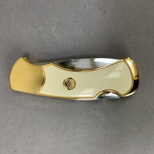 17 - A ten point buck collector knife by Franklin Mint, stainless steel blade, gilt metal frame cast with... 