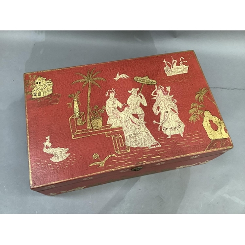 4 - A chinoiserie storage box of red ground printed with figures in a garden landscape, 41cm wide by 26c... 