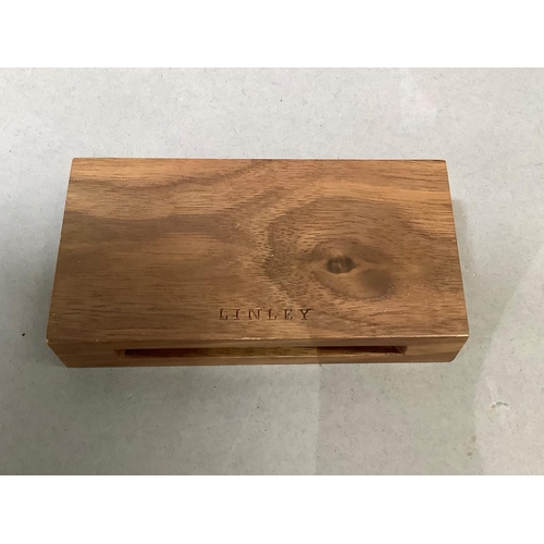 5 - A David Linley matchbox case, inset with a silver plaque and containing a box of Linley matches, unu... 