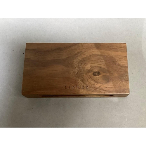 5 - A David Linley matchbox case, inset with a silver plaque and containing a box of Linley matches, unu... 