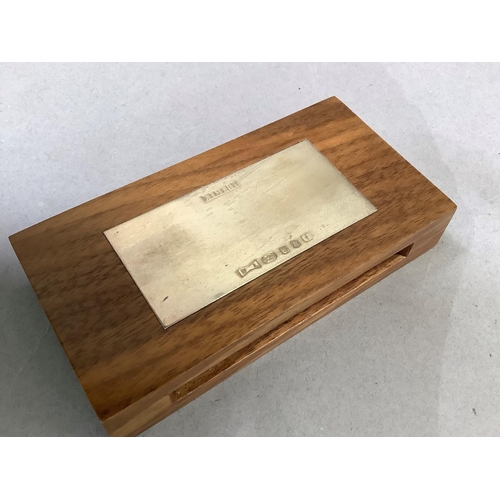 5 - A David Linley matchbox case, inset with a silver plaque and containing a box of Linley matches, unu... 