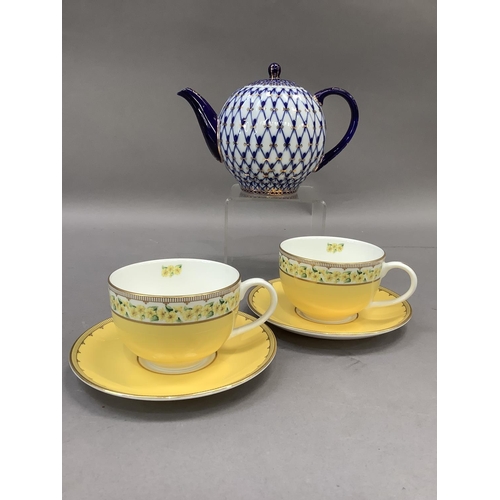 37 - A pair of Halycon Days cups and saucers for Castle Mey and a Russian China blue white and gilt teapo... 