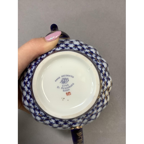 37 - A pair of Halycon Days cups and saucers for Castle Mey and a Russian China blue white and gilt teapo... 