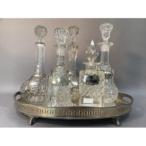 65 - Five various glass decanters of cut and etched design, each with a modern silver spirit label togeth... 