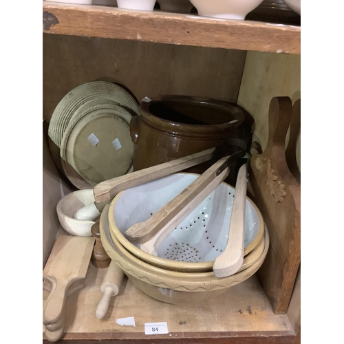 84 - A salt glazed terracotta bread crock, two circular bread boards, an oak carved bread board, washing ... 