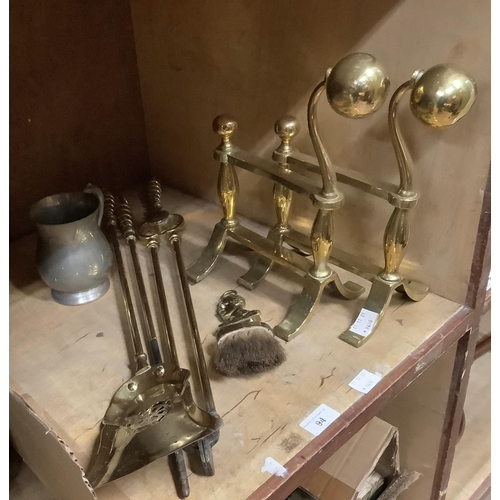 94 - A pair of Edwardian brass firedogs, together with a set of three Victorian fire irons with spiral tw... 