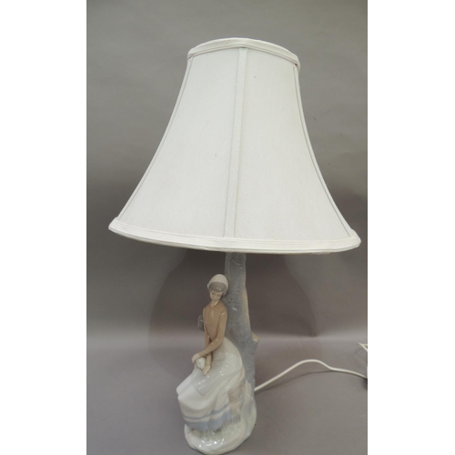 28 - A Nao lamp modelled as a country girl with sheep, 45cm to fittings approximately