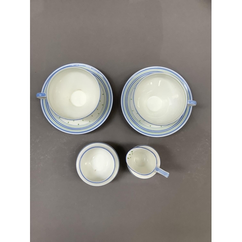 19 - A 1930s Royal Doulton tea for two set comprising two cups and saucers, milk jug and sugar bowl, pain... 