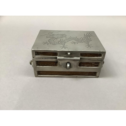 2 - A Chinese hardwood and pewter casket, c.1930s, modelled as a strong box, the cover incised with a si... 