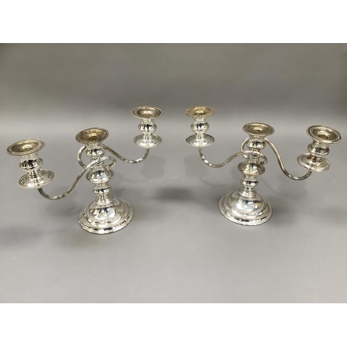 26 - A pair of presentation plate silver on copper three light candelabra with reeded arms, baluster colu... 