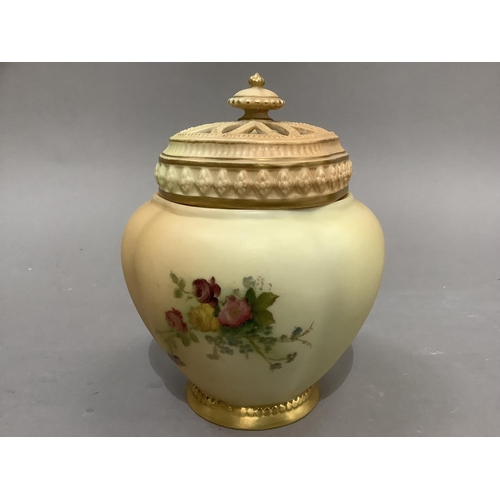 45 - A Royal Worcester pot pourri vase of lobed ovoid form having a pierced beaded cover with knop finial... 