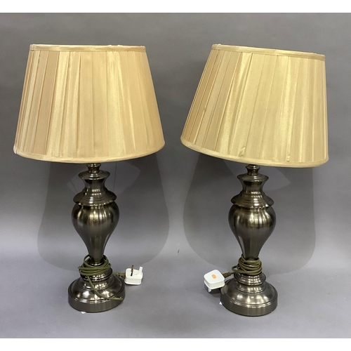 184 - A pair of pewter coloured table lamps of baluster form on circular bases complete with shades, 46cm ... 