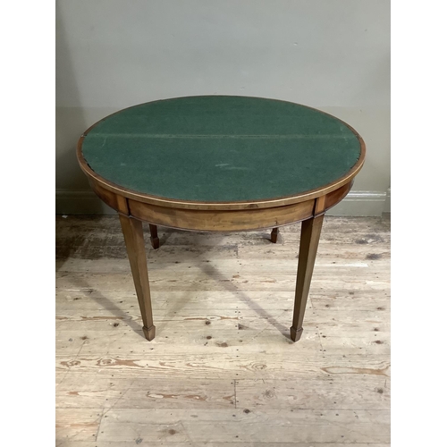 362 - A 19th century mahogany and cross banded demi lune card table inlaid with a shell paterae, on square... 