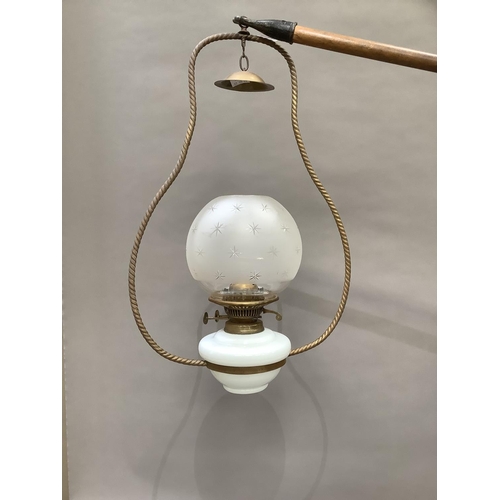 363 - A late Victorian hanging lantern having a white glass reservoir and a star etched opaque glass shade... 