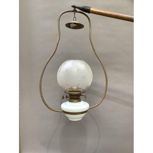 363 - A late Victorian hanging lantern having a white glass reservoir and a star etched opaque glass shade... 