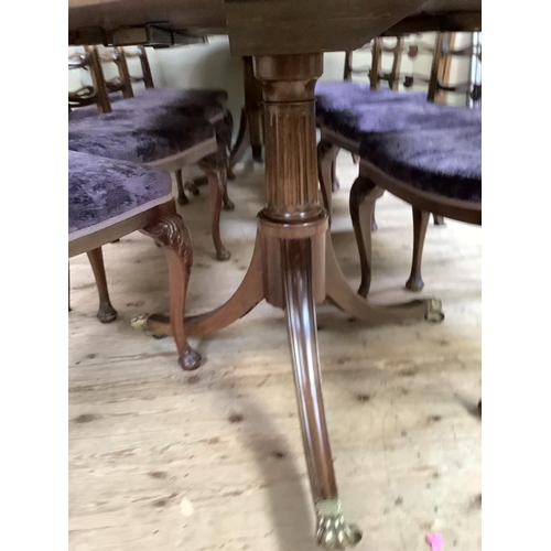 365 - A mahogany and rosewood cross banded twin pedestal dining table on down swept moulded legs with bras... 