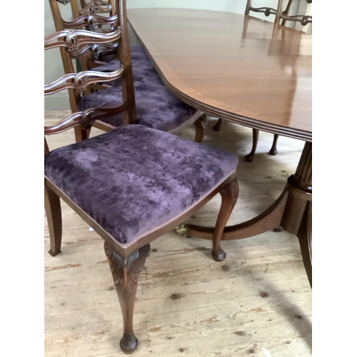 365 - A mahogany and rosewood cross banded twin pedestal dining table on down swept moulded legs with bras... 