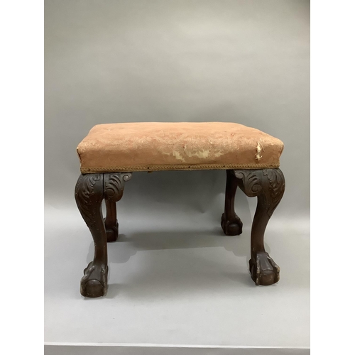 366 - An 18th century style mahogany dressing stool with an upholstered top and on bold leaf carved cabrio... 