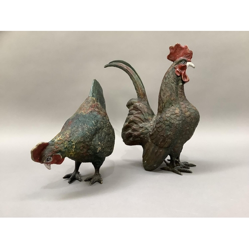 1 - A cold painted metal cockerel and hen, 29cm high