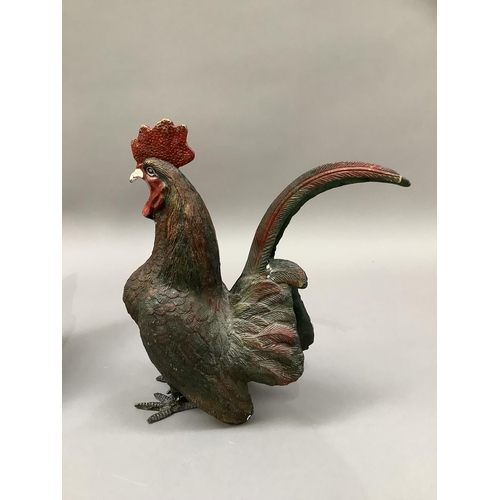 1 - A cold painted metal cockerel and hen, 29cm high