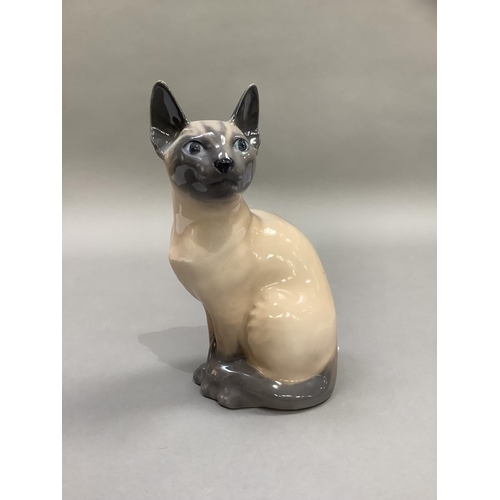 16 - A Royal Copenhagen figure of a Siamese cat, 19cm high