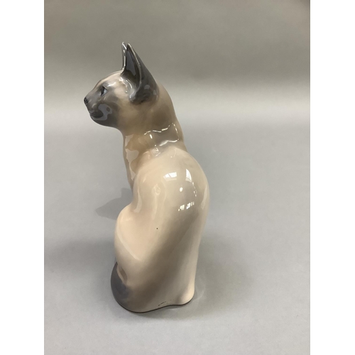 16 - A Royal Copenhagen figure of a Siamese cat, 19cm high