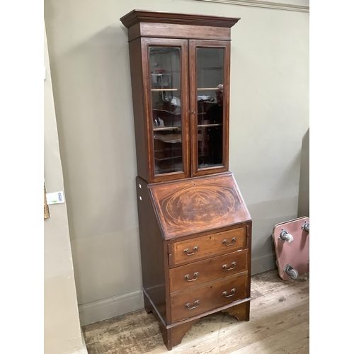 187 - An Edwardian mahogany and satinwood banded bureau bookcase having a moulded cornice above two glazed... 