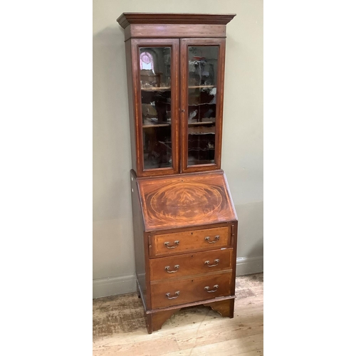 187 - An Edwardian mahogany and satinwood banded bureau bookcase having a moulded cornice above two glazed... 