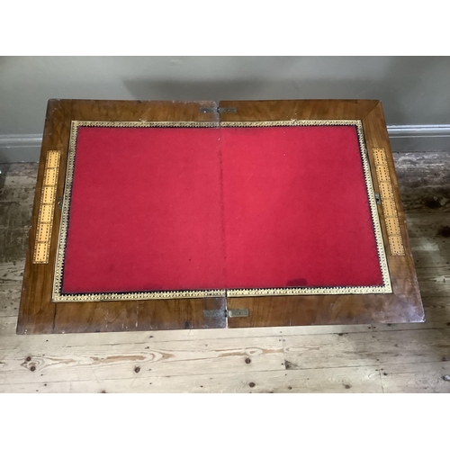 196 - A Victorian walnut and Tunbrigeware banded combined games and work table inlaid to the fold over top... 