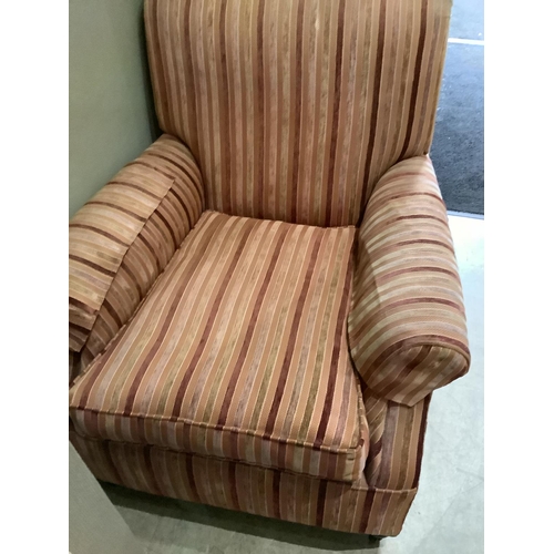 197 - An Edwardian arm chair, reupholstered in velvet and flat weave stripe in tones of coral, on bun feet... 