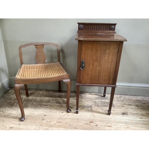 162 - An Edwardian mahogany pot cupboard having a short raised back, single door on square tapered legs, t... 