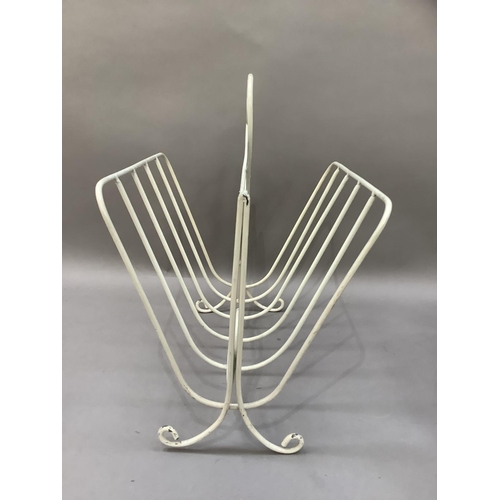 141 - A late 1960s white wire work magazine rack, 37cm wide