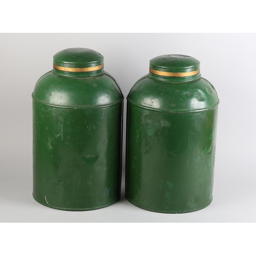 161 - A pair of 19th century toleware tea canisters, cylindrical, the green ground with panel and numbers ... 