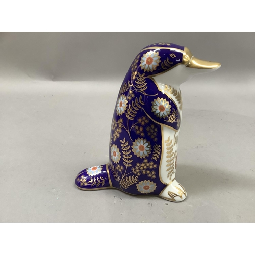 82 - A Royal Crown Derby platypus paperweight, gilt button, 12cm high