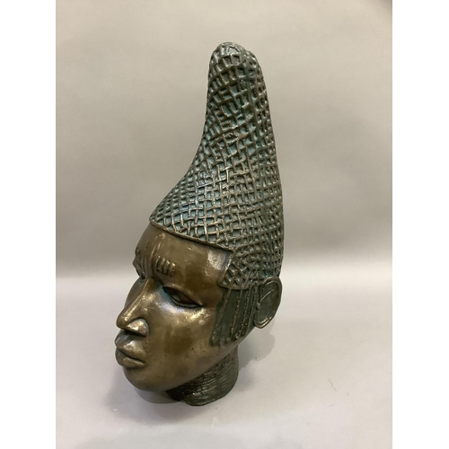 86 - A ceramic bust of tribal female, polished bronze-effect and verdigris finish, with elaborate head-dr... 