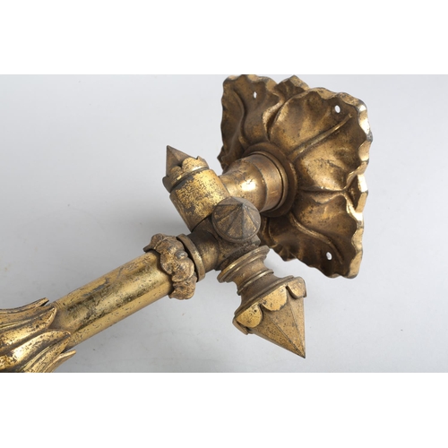 94 - A Victorian lacquered brass wall sconce with foliate plate and swing arm, approximate 56cm long