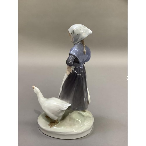 95 - A Royal Copenhagen figure of a goose girl and gander, printed and painted mark to underside
19cm hig... 