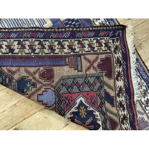 452 - A vintage prayer rug, the camel field with prayer niche and pillars in shades of blue and coral with... 