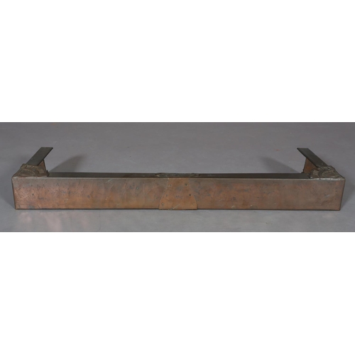 423 - A copper covered fire kerb, c.1915, with central and corner foliate embossed panels, 110cm wide x 35... 