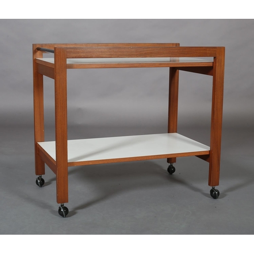 439 - A walnut and white melamine two tier trolley c.1970s with galleried sides and ebonised rail ends, on... 