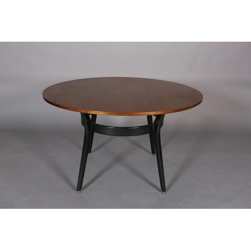 441 - An early G Plan mahogany and ebonised circular dining table, c.1950s, the tapered legs joined by a b... 