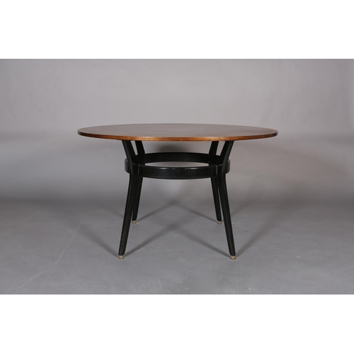 441 - An early G Plan mahogany and ebonised circular dining table, c.1950s, the tapered legs joined by a b... 