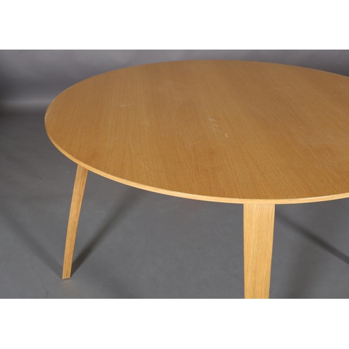 442 - A Gubi laminated beech dining table by  Komplot Design, circular, on laminated square tapered and sp... 