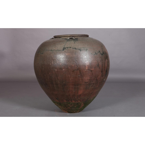 445 - A large glazed earthenware vessel, of tapered compressed globular form with three lugs to the should... 