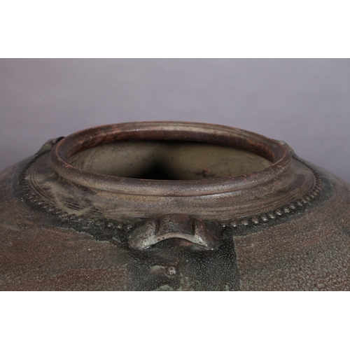 445 - A large glazed earthenware vessel, of tapered compressed globular form with three lugs to the should... 