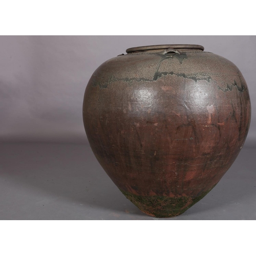 445 - A large glazed earthenware vessel, of tapered compressed globular form with three lugs to the should... 