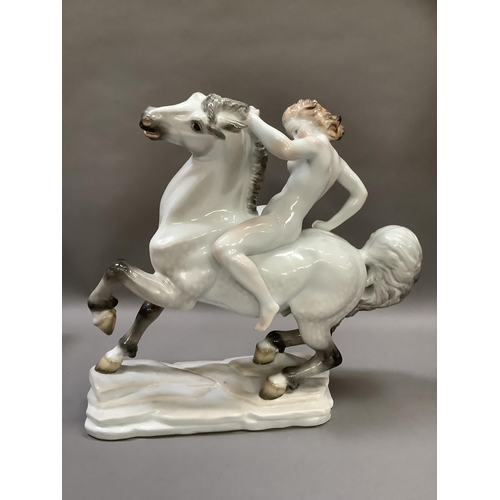 1 - A Herend porcelain figure of a nude female on horseback on a naturalistic rectangular plinth base, b... 